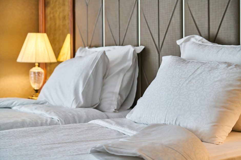 Photo by Engin Akyurt on Pexels Neatly made bed with white pillows and bedside lamps in a modern bedroom. Photo by Engin Akyurt on Pexels