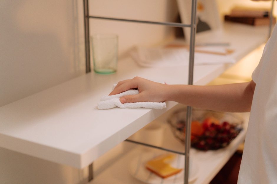Photo by cottonbro studio on Pexels Hand wiping a white kitchen shelf clean with a cloth after pest control treatment. Photo by cottonbro studio on Pexels